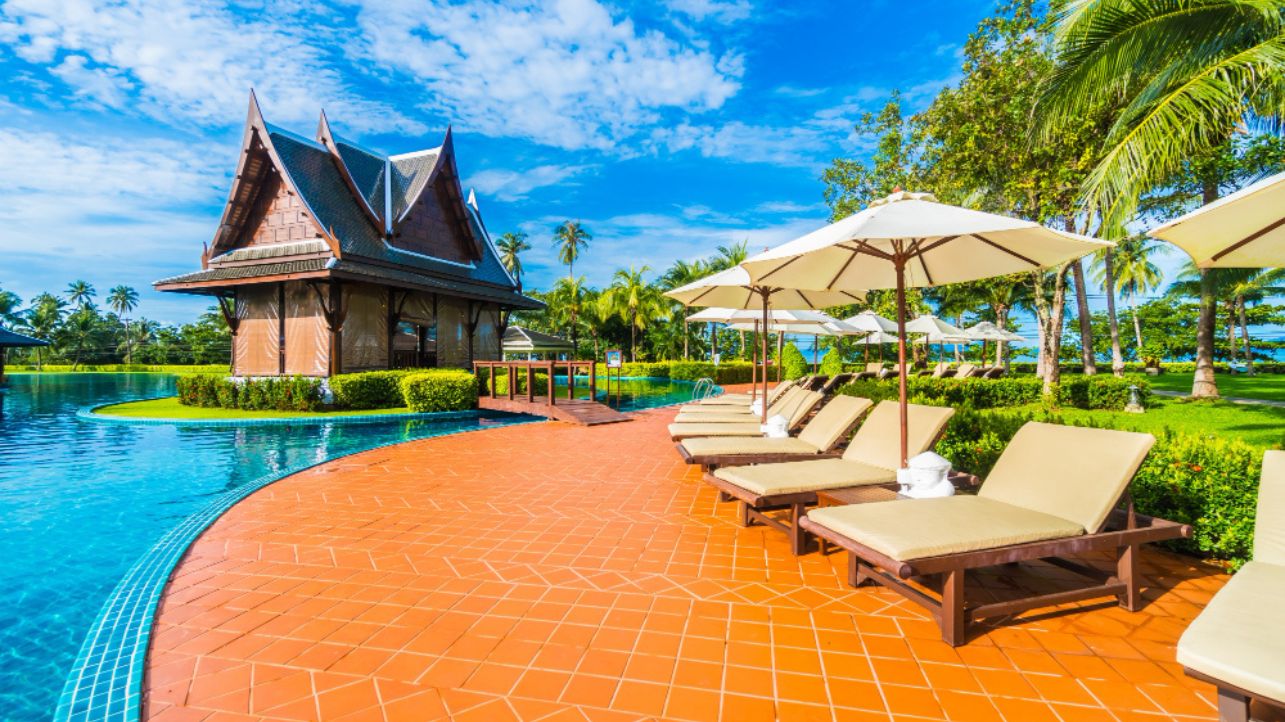 Luxury vacation resort with swimming pool and palm trees